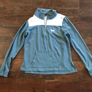 Turquoise and white hoodie with white dog